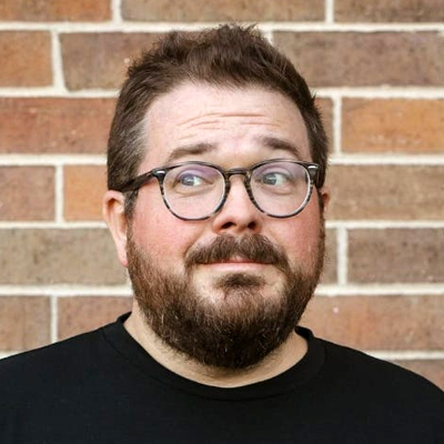 Editorial circular headshot of Dr. Tripp Fuller, podcast host and teacher